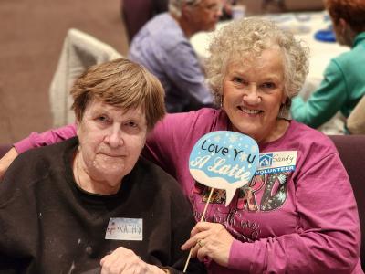Elder Orphan Care volunteer Sandy is an outstanding buddy for Kathy