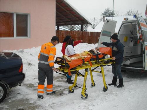 Viorel Pasca receives an elder orphan arriving in an ambulance in Romania