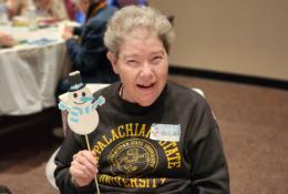 Client Wilma enjoys Elder Orphan Care seasonal celebrations